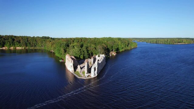 Scenic drone shot of Koknese castle ruins next to river Daugava, Latvia