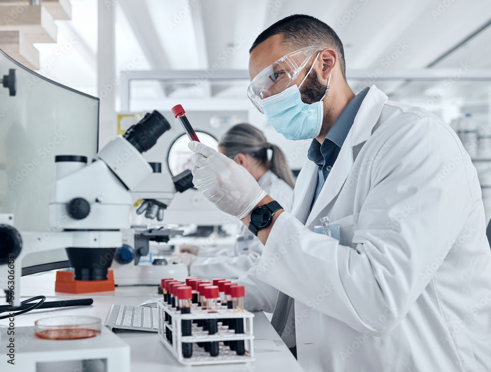 Aufkleber Scientist doing research for covid using a microscope and test tube in a lab. Healthcare worker in biotechnology, medicine and analytics testing liquid in science laboratory for blood sample results