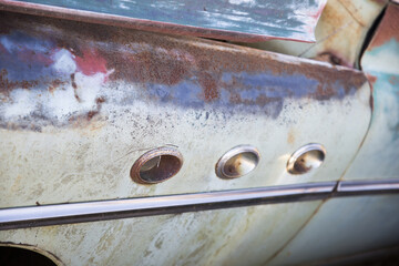Old rusty fender of a car