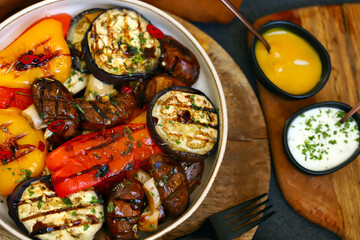 Grilled vegetables on a plate. Healthy food. Appetizing grilled peppers, eggplant, mushrooms.
