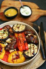 Grilled vegetables on a plate. Healthy food. Appetizing grilled peppers, eggplant, mushrooms.