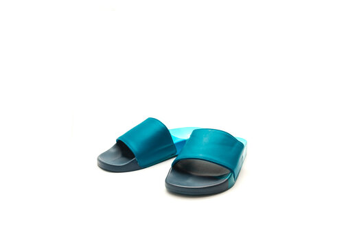 Brand New A Pair Of Blue Slide Sandals For Men With Faux-leather Upper, Comfortable Foam Lining And Contoured Foot Bed Isolated On White Background