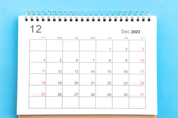 close-up of calendar december of november 2023 top view on a blue background