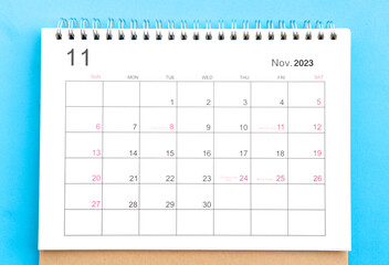 close-up of calendar month of november 2023 top view on a blue background