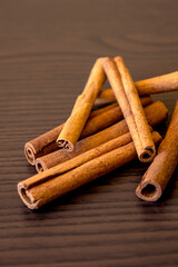 cinnamon sticks close up on dark background