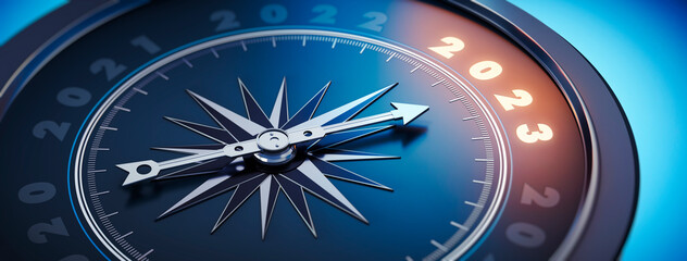 Dark blue compass with needle pointing to the illuminated number 2023   © peterschreiber.media