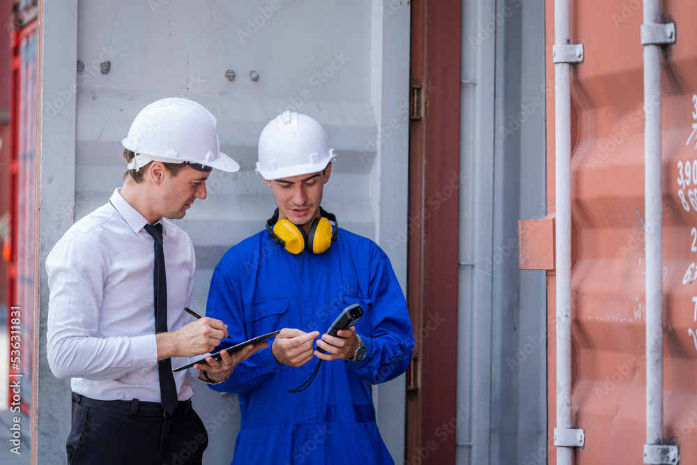 Poster engineer works with co-worker at overseas shipping container yard,international goods export concept