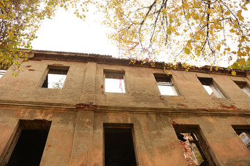Abandoned building at autumn time