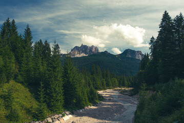 Dolomites mountain peak and wild river