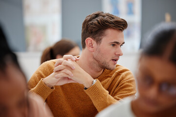 College, student and study in a university classroom or lecture for education, scholarship and training. Thinking male learning and talking in workshop with group of school students in an academy © S Fanti/peopleimages.com