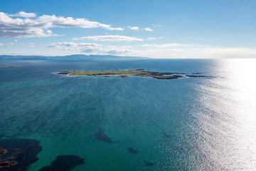 Aerial view of Inishkeeragh island seen from Clouhhcorr beach on Arranmore Island in County Donegal, Republic of Ireland