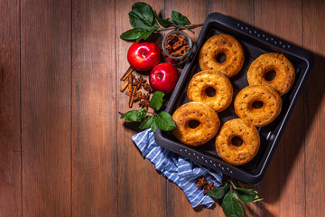 Traditional tasty ready to eat apple cider donuts. Homemade baked apple cinnamon donuts with apple...