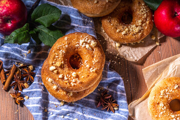 Traditional tasty ready to eat apple cider donuts. Homemade baked apple cinnamon donuts with apple...