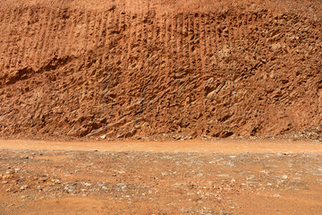 Construction site dirt mountain scratched slope with road background texture