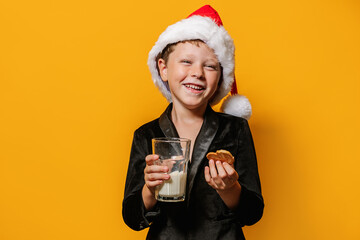 Boy in Santa hat enjoying milk