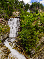 Cascade waterfall on Tauernbach in National Park High Tauern.