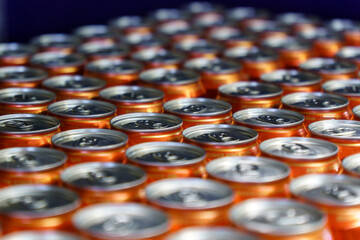 A lot of beer aluminum cans background texture. Sale of alcohol in a hypermarket
