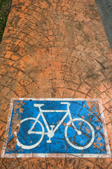 Fototapeta na wymiar Sign with a bicycle in a reserved bicycle lane in Pekan, Malasia