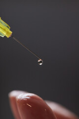 Doctor doing stem cell therapy on a patient's elbow after the injury. Treating knee pain with...