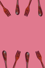 Top view on many bamboo spoons and forks on a yellow background, Eco tableware, disposable cutlery, recycle reusable utensil on white background top view. Disposable take away table wear concept