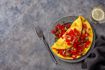 omelette with tomato, bell pepper onion chili and cheese. healthy breakfast