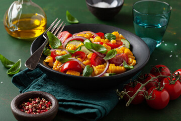 healthy vegetarian tomato sweet corn salad with cucumber and basil