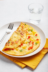 omelette with tomato, bell pepper onion and cheese. healthy breakfast