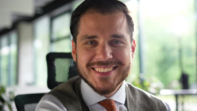 Confident handsome mid aged businessman professional financial advisor, executive leader, manager, male lawyer or man entrepreneur sitting in office posing for headshot business portrait.