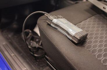 Professional car mechanic working in auto repair service.