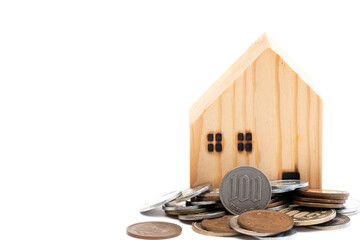 wooden house with Japanese coins isolated on white