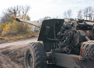 Fototapeta premium War in Ukraine, captured Russian 150-mm howitzer, rear view