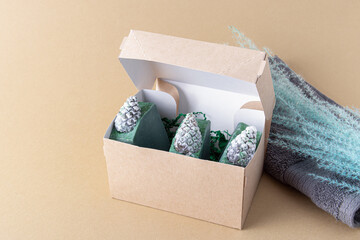 Natural handmade soap with coniferous aroma in box. Gift set for Christmas. Soap with the shape of cones