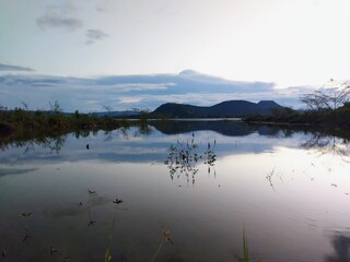 Evening atmosphere by the reservoir, Sappradu Reservoir, Sikhio District, Nakhon Ratchasima, Thailand. A way of life that must be lived in order to survive.  interdependence between people and nature