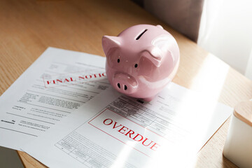 Close-up Piggy bank with savings and calculator with documents on the desk The concept of pension,