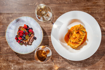 Fototapeta na wymiar Spaghetti with shrimp and duck breast with foie gras