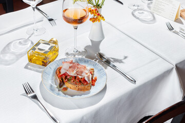 Bruschetta with prosciutto and tomatoes