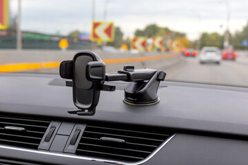 Phone holder on the car dashboard