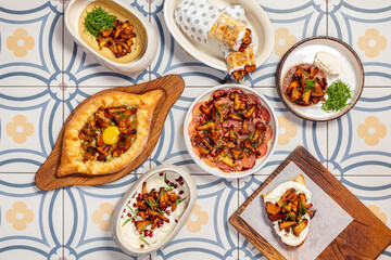 Assorted Caucasian dishes with fried chanterelle mushrooms