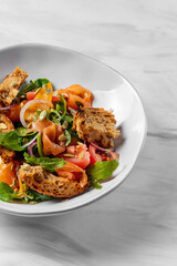 Salad with salmon.