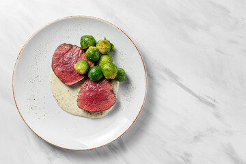 Filet mignon steak with Brussels sprouts