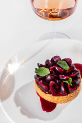 Cherry tart with a glass of wine