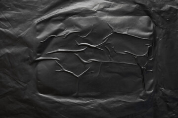 transparent plastic bag wrap overlay texture on black background