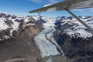 Airplane wing and mountain landscape in Glacier Bay National Park