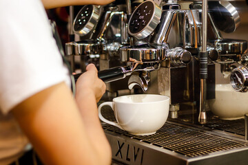Asian woman making coffee for customers. Coffee shop concept. Small Business, SME, Entrepreneur, Professional Barista