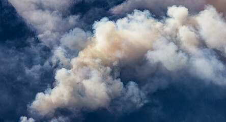 BC Forest Fire and Smoke over the mountain near Hope during a hot sunny summer day. British Columbia, Canada. Wildfire natural disaster