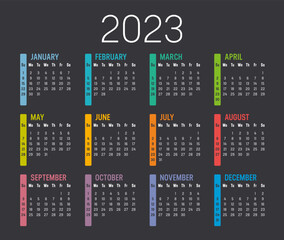 Colorful year 2023 calendar, isolated on a dark background. Vector template.
