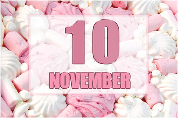 calendar date on the background of white and pink marshmallows. November 10 is the tenth day of the month