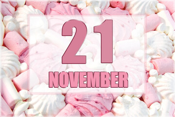 calendar date on the background of white and pink marshmallows. November 21 is the twenty first day of the month