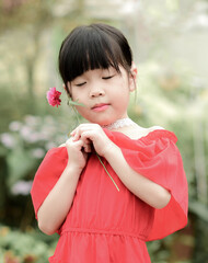 pretty little girl with the red dress on