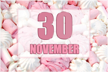calendar date on the background of white and pink marshmallows. November 30 is the thirtieth day of the month